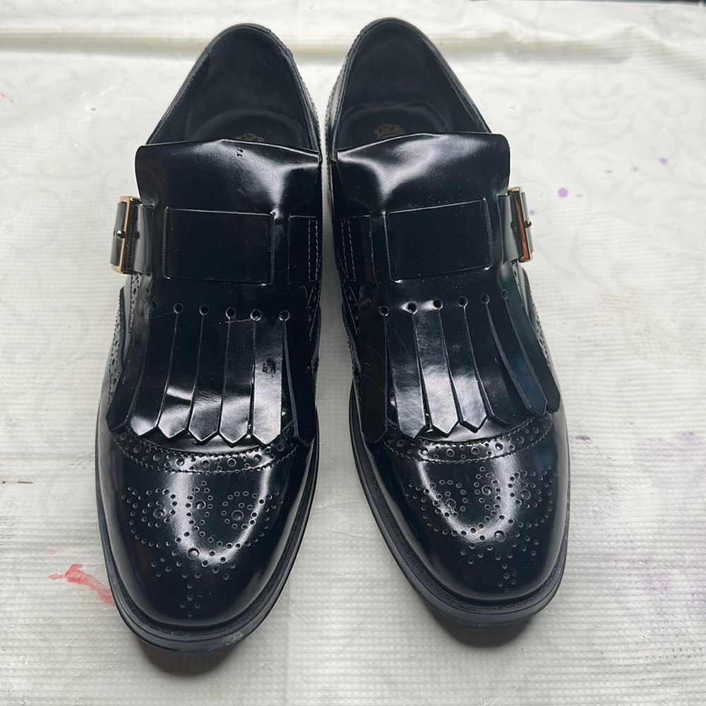 Tod’s Oxford black patent leather shoes